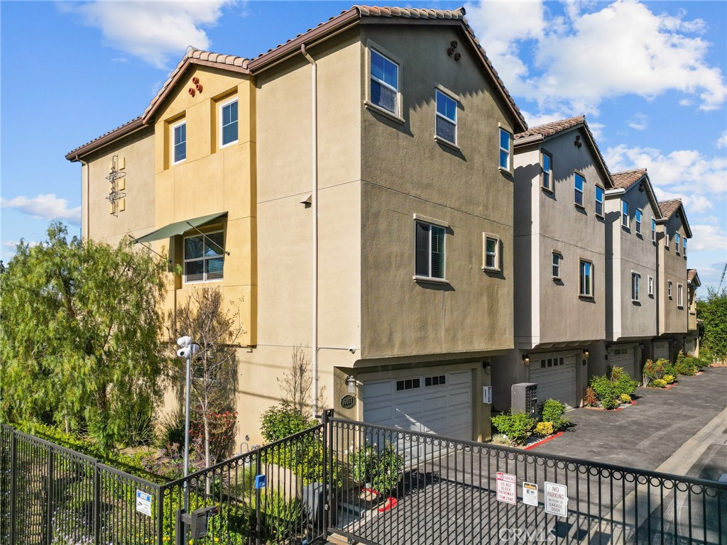 16863 Balboa Boulevard Van Nuys, CA 91406 - Photo 4 of 34 a front view of a house with large windows