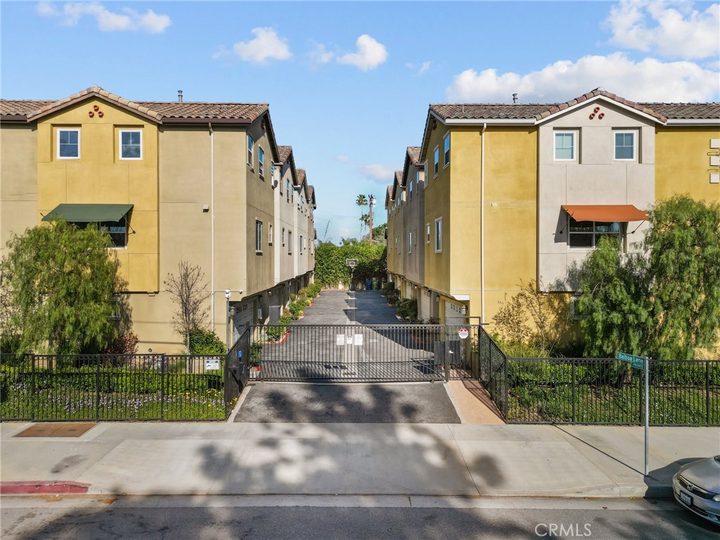 16863 Balboa Boulevard Van Nuys, CA 91406 - Photo 5 of 34 a front view of a house with a yard