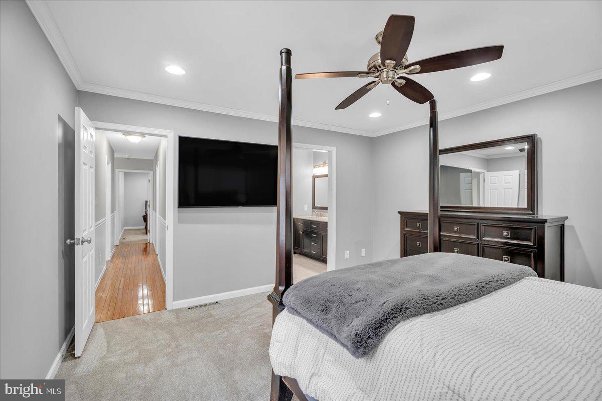 114 Peach Road Marlton, NJ 08053 - Photo 14 of 46 a bedroom with a bed and a flat screen tv