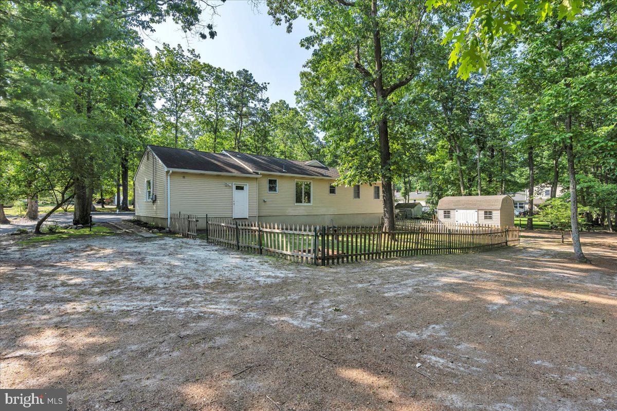 114 Peach Road Marlton, NJ 08053 - Photo 28 of 46 a view of a house with a yard and large trees