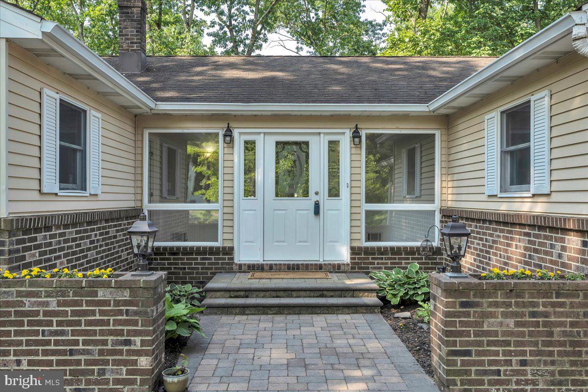114 Peach Road Marlton, NJ 08053 - Photo 3 of 46 a front view of a house with a garden