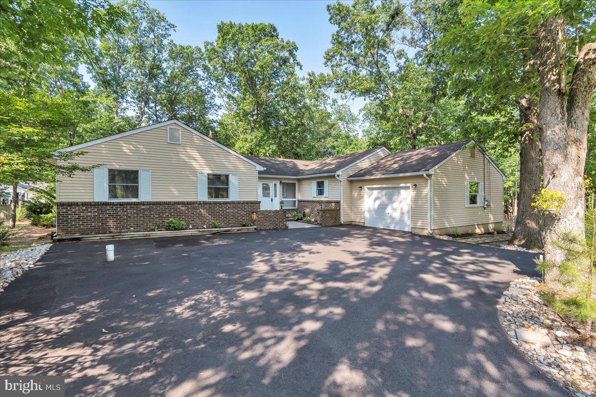 114 Peach Road Marlton, NJ 08053 - Photo 46 of 46 a front view of a house with a garden and yard