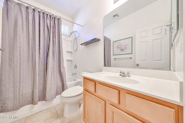 a living room with furniture potted plant and a window