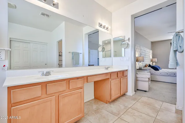 a bathroom with a sink a toilet and shower curtain