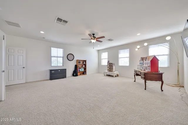 a view of storage and utility room with washer and dryer