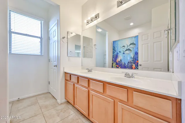 a bedroom with baby toys and a dresser