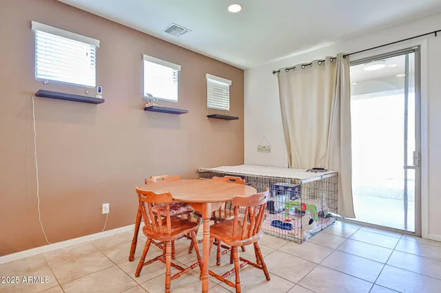 a kitchen with stainless steel appliances granite countertop a sink refrigerator and cabinets
