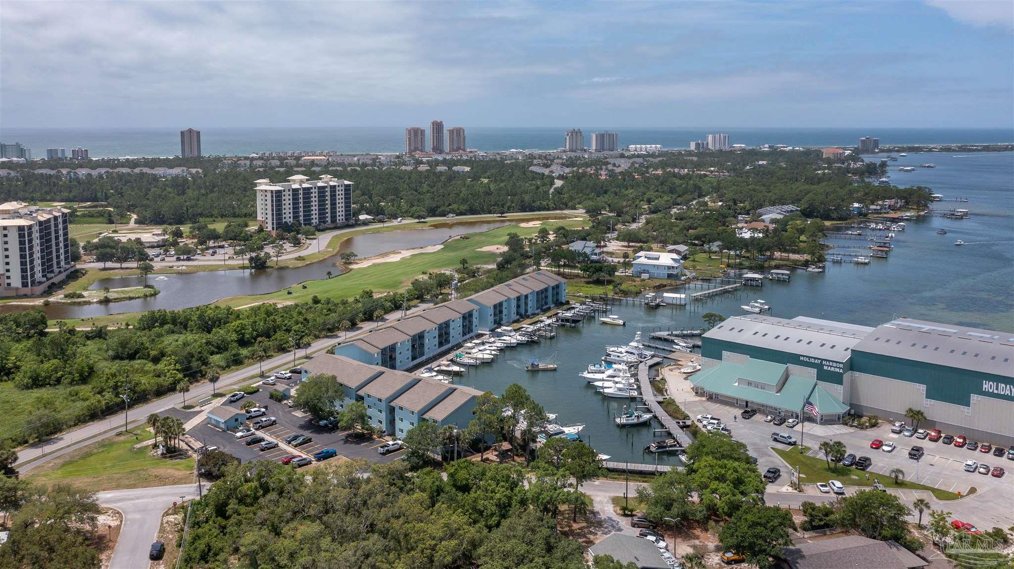 14100 River Road, Unit 122B Perdido Key, FL 32507 - Photo 40 of 46 an aerial view of a city with swimming pool and ocean view