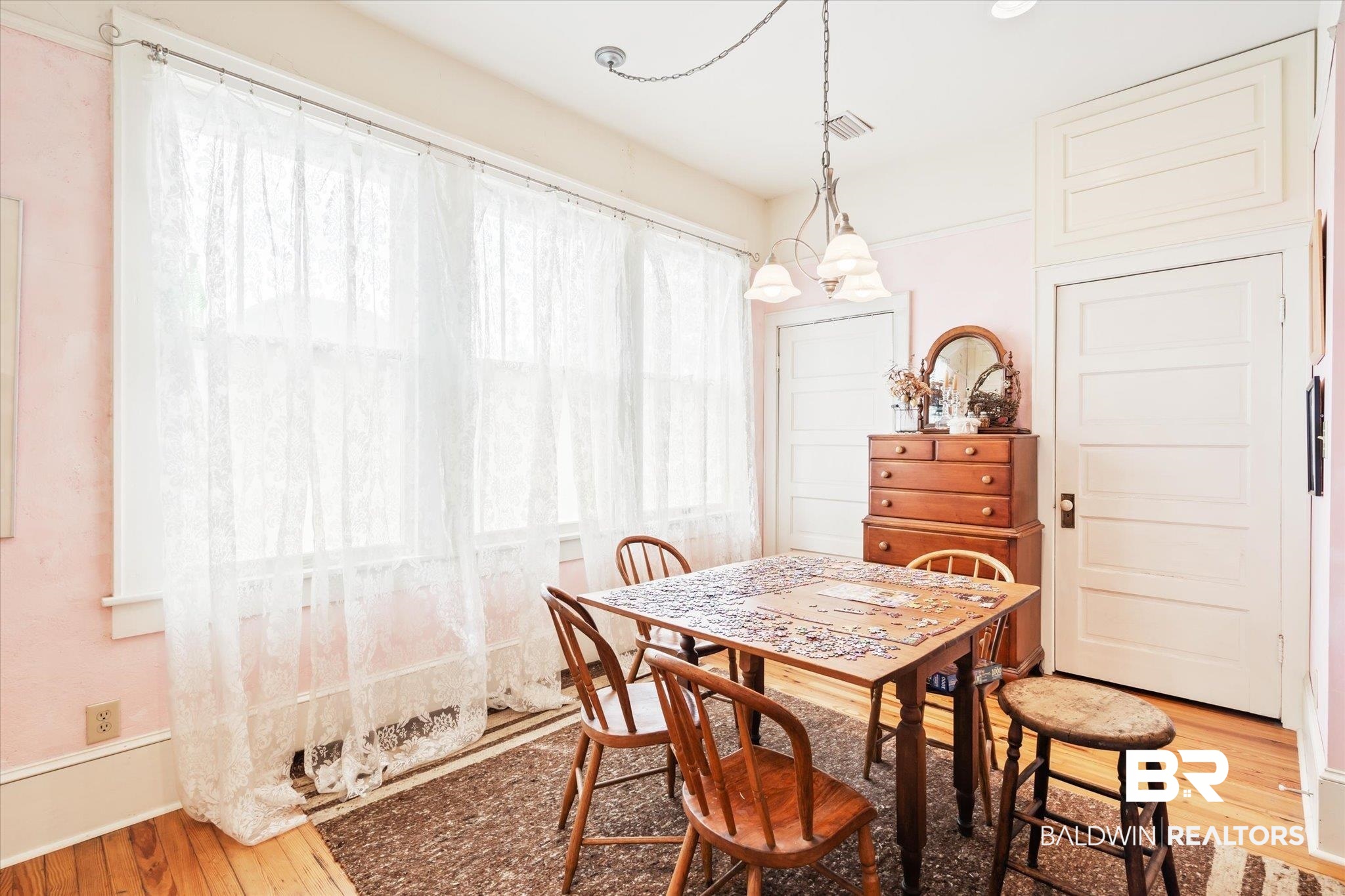 12 Lebaron Street Mobile, AL 36602 - Photo 16 of 37 Dining room with wood-type flooring, a notable chandelier, and plenty of natural light