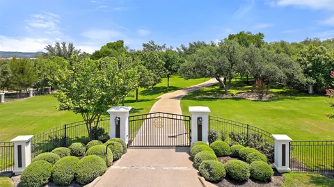 a aerial view of a house next to a yard