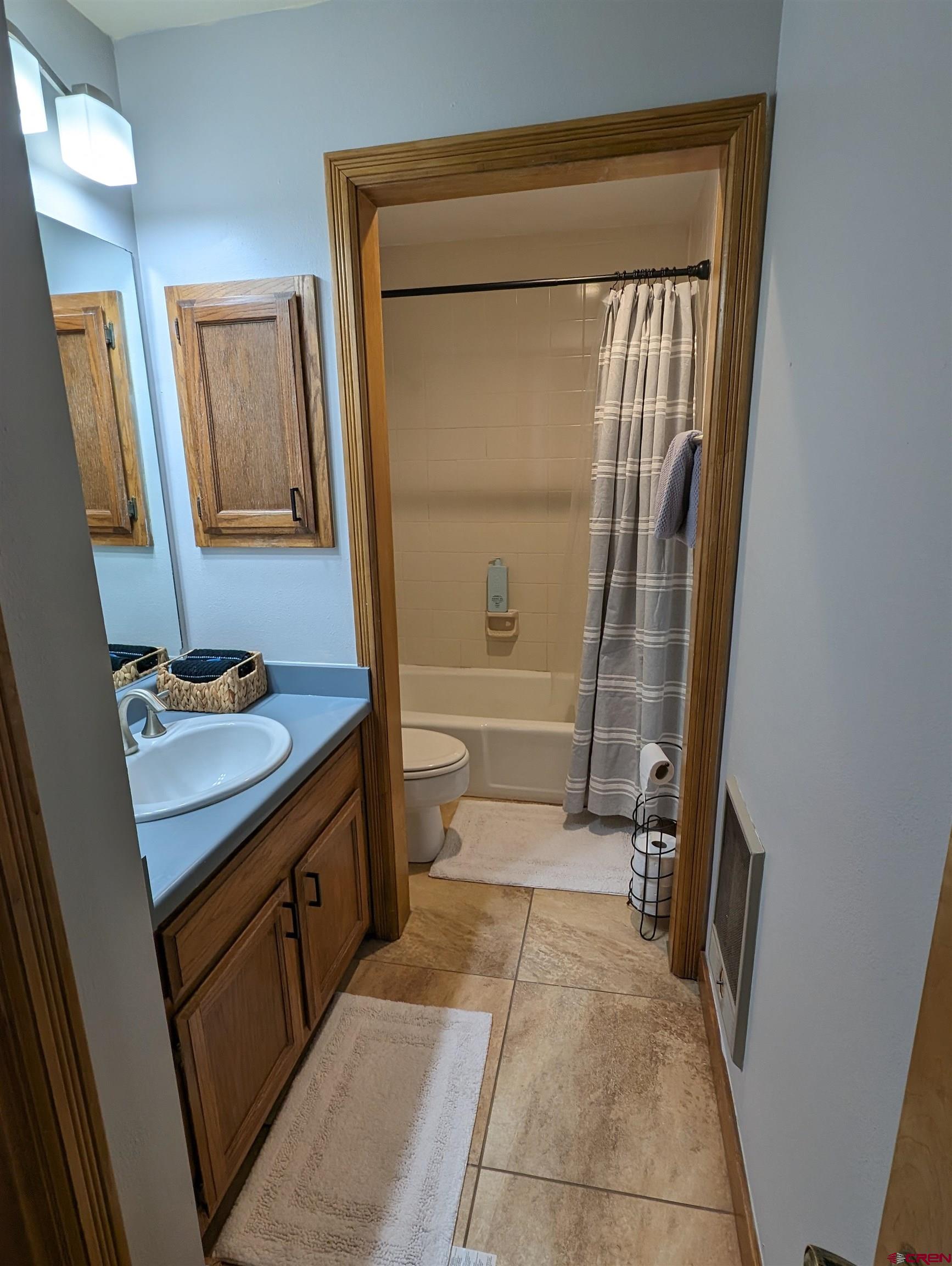 6 Ferringway Circle, Unit 12 Durango, CO 81301 - Photo 14 of 23 a bathroom with a granite countertop sink toilet and shower