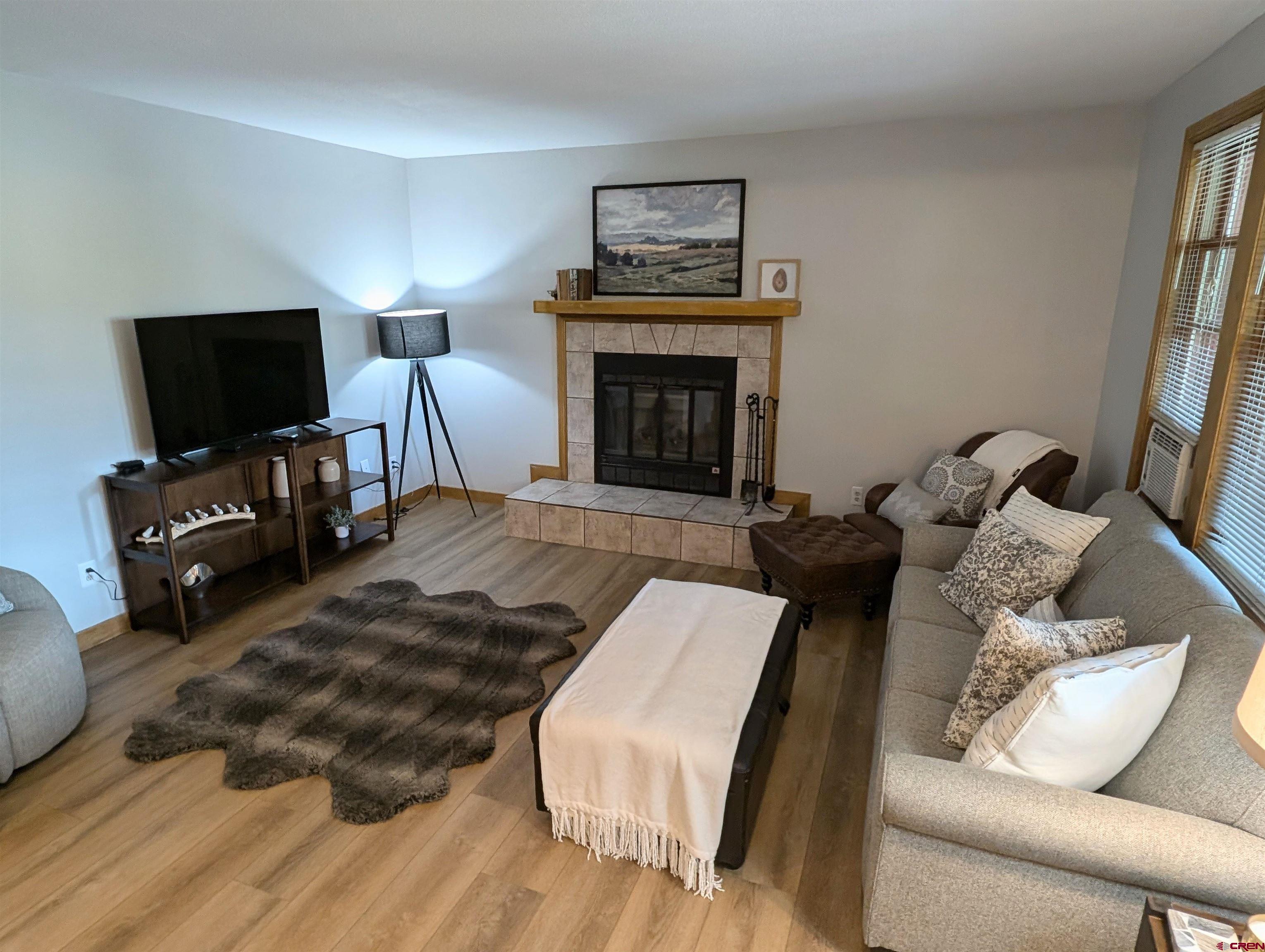 6 Ferringway Circle, Unit 12 Durango, CO 81301 - Photo 2 of 23 a living room with furniture and a fireplace