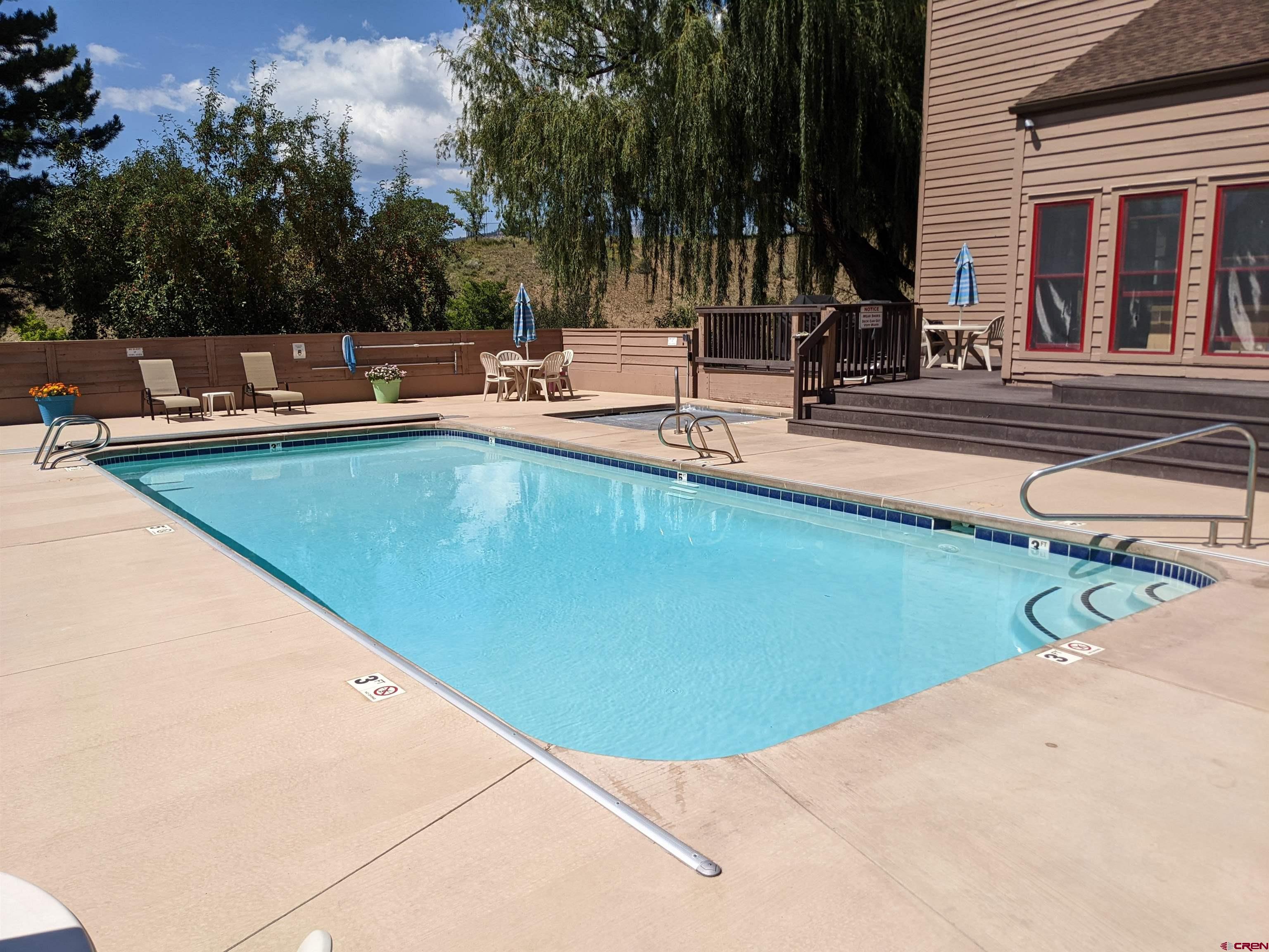 6 Ferringway Circle, Unit 12 Durango, CO 81301 - Photo 21 of 23 a view of a swimming pool with chairs