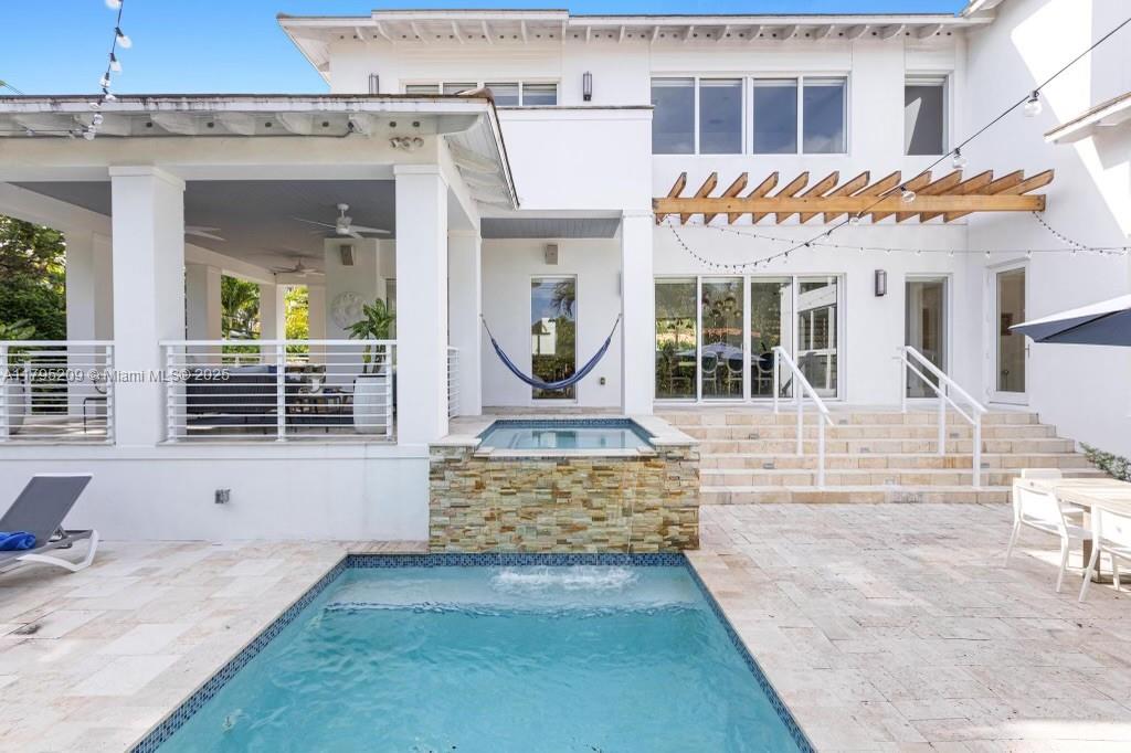 689 Glenridge Road Key Biscayne, FL 33149 - Photo 20 of 48 a view of a house with wooden fence