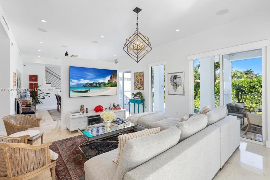 689 Glenridge Road Key Biscayne, FL 33149 - Photo 21 of 48 a living room with furniture and a flat screen tv