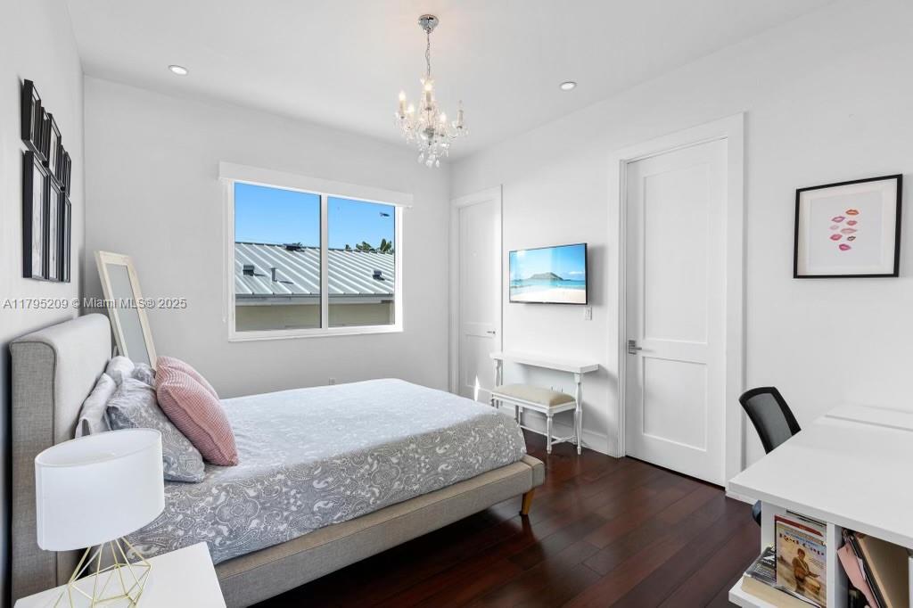 689 Glenridge Road Key Biscayne, FL 33149 - Photo 30 of 48 a bedroom with a bed window and couch