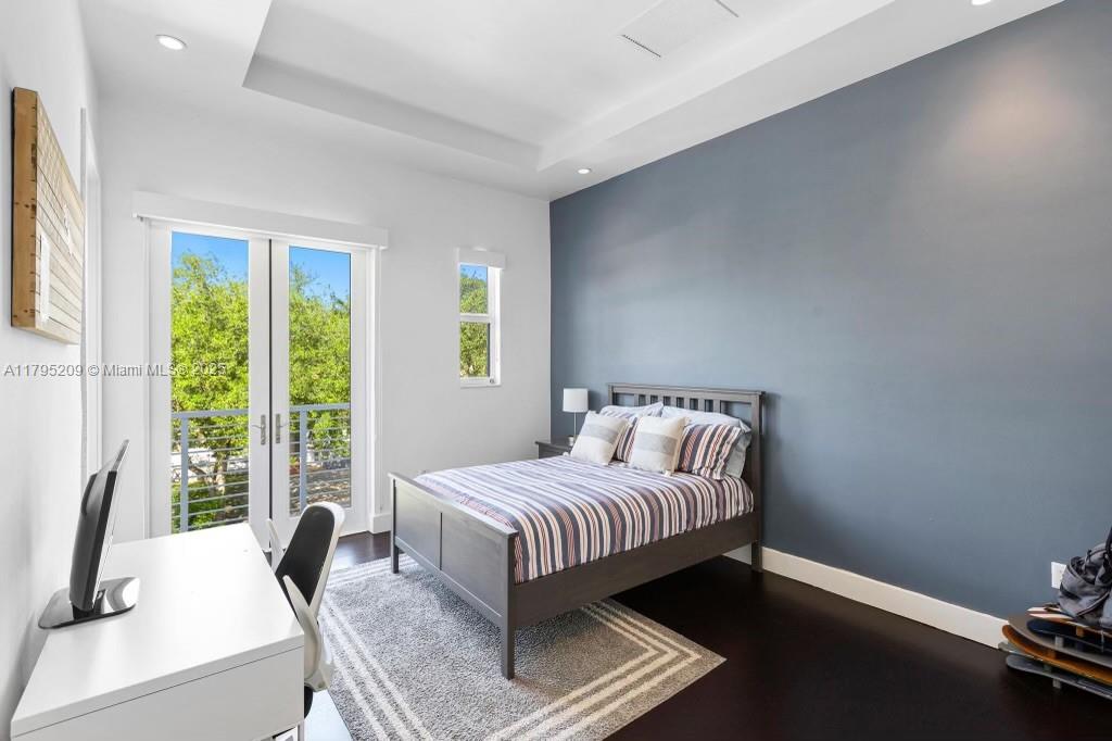 689 Glenridge Road Key Biscayne, FL 33149 - Photo 35 of 48 a bedroom with a bed and a window