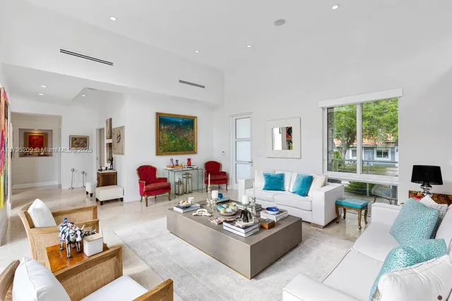 a living room with furniture rug and window