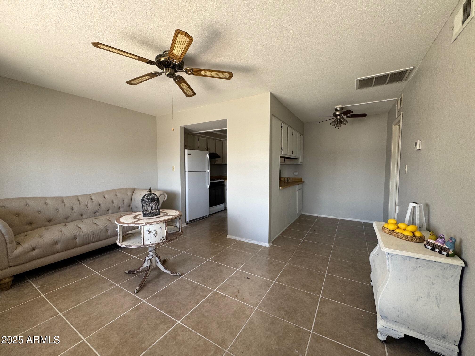 875 East Lancaster Circle Florence, AZ 85132 - Photo 3 of 13 a living room with furniture and a rug