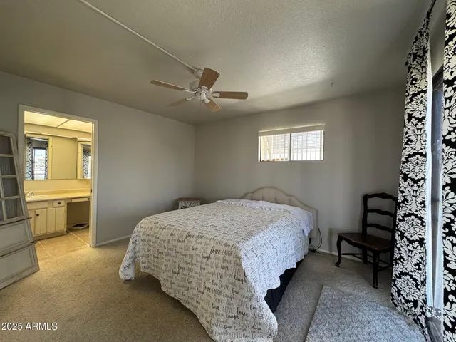 a kitchen with stainless steel appliances granite countertop a refrigerator a stove and a sink