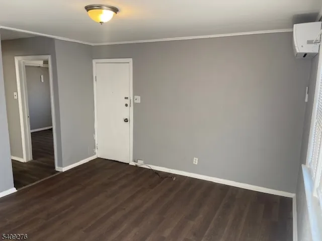 an empty room with wooden floor