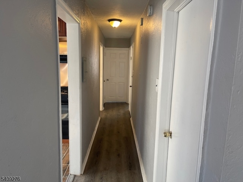 1112 Rivington Street Roselle, NJ 07203 - Photo 7 of 13 a view of hallway with stairs
