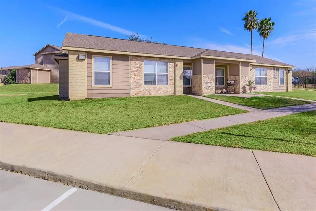 a view of a yard in front of a house