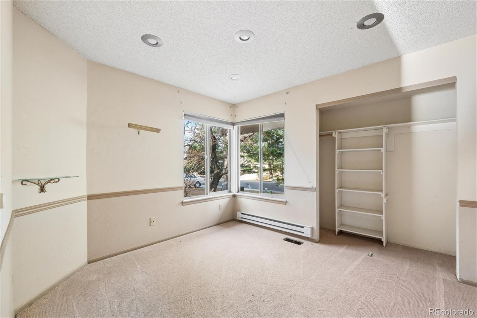 8554 Redstone Street Highlands Ranch, CO 80126 - Photo 17 of 33 a view of an empty room with a window