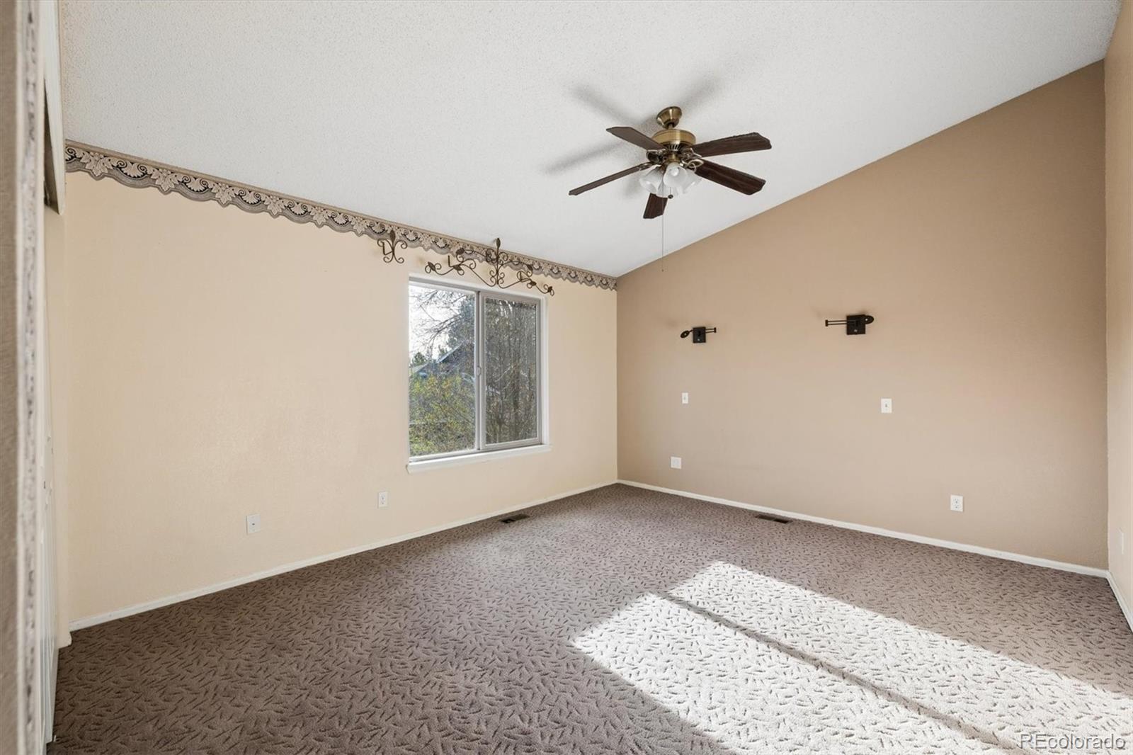 8554 Redstone Street Highlands Ranch, CO 80126 - Photo 21 of 33 a view of an empty room with a window