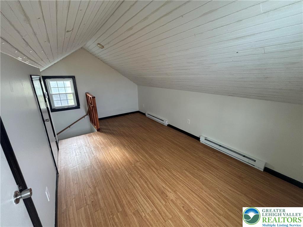 654 Youngs Hill Road Easton, PA 18040 - Photo 20 of 36 a view of an empty room with wooden floor and a window