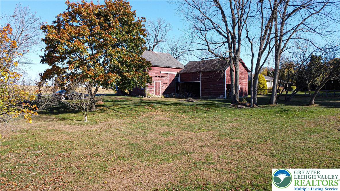 654 Youngs Hill Road Easton, PA 18040 - Photo 32 of 36 a view of a backyard with large trees