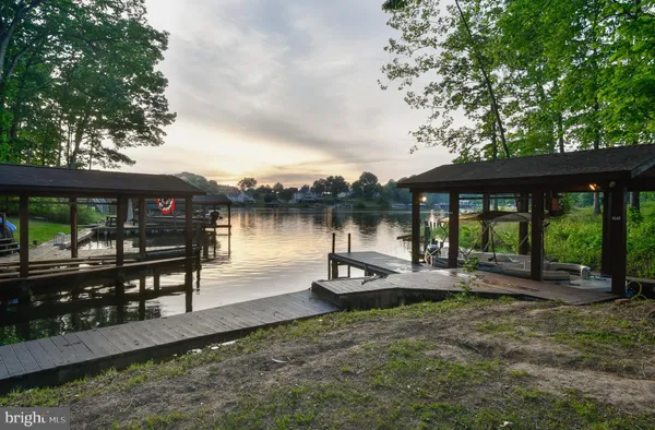 a view of a lake with sitting area