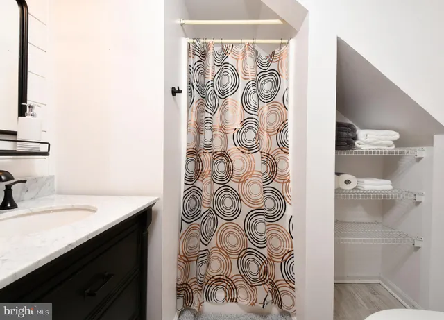 a kitchen with stainless steel appliances granite countertop a refrigerator sink and stove