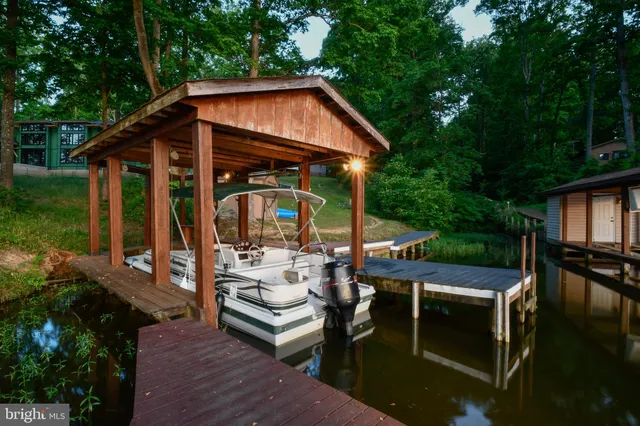 a view of house with backyard a patio and outdoor seating