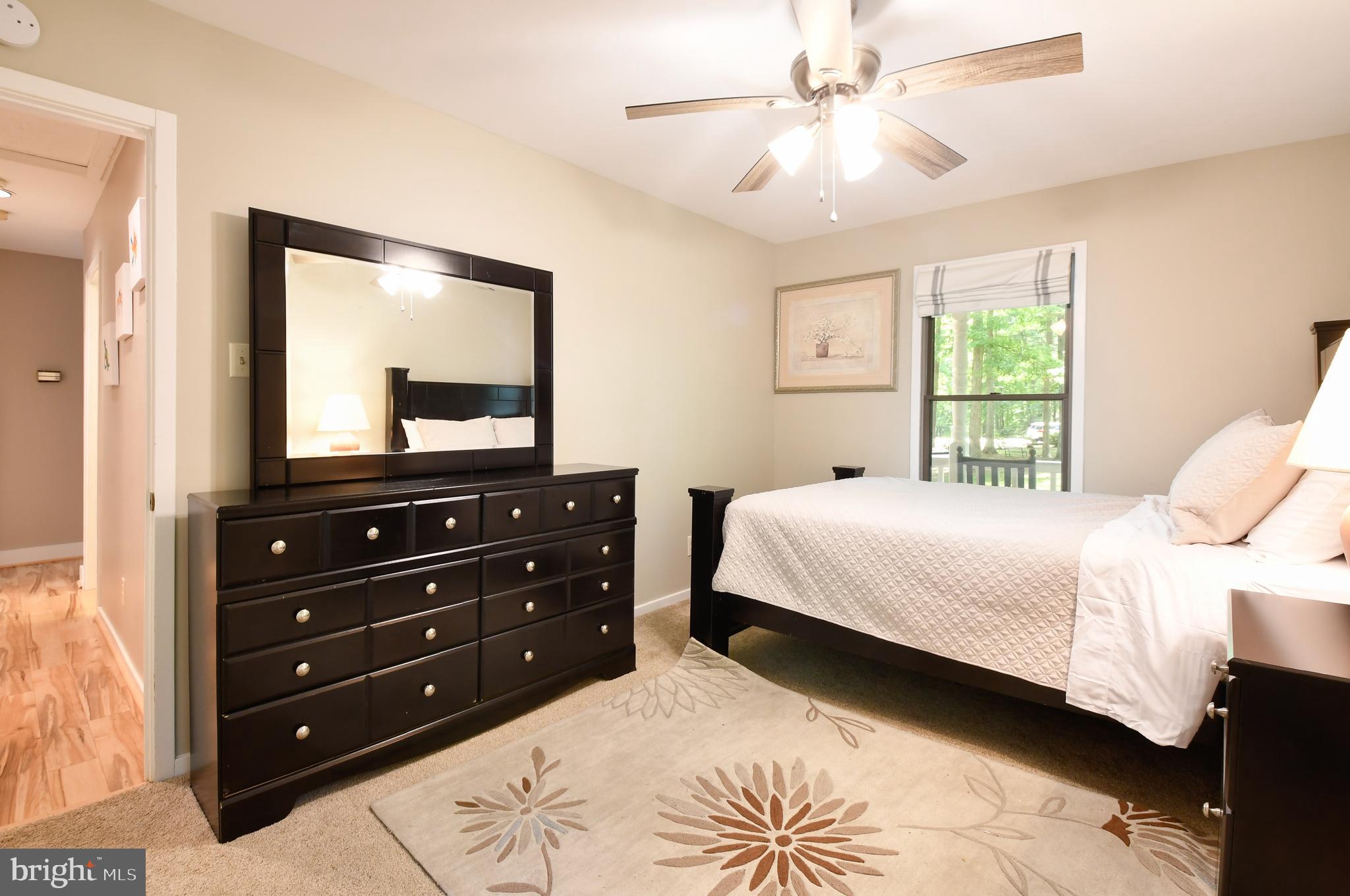 35 Tomahawk Circle Mineral, VA 23117 - Photo 6 of 25 a bedroom with a bed and a mirror on dresser
