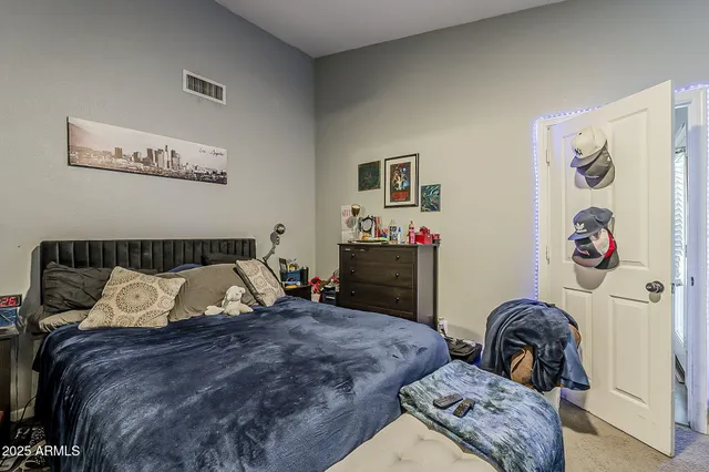 a bedroom with bed and a couch