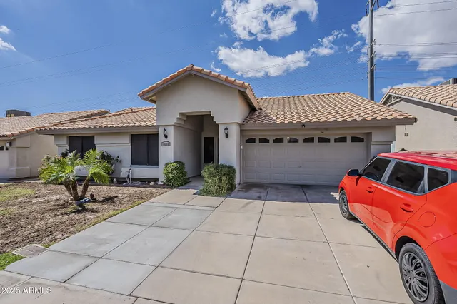 a front view of house with yard outdoor seating and barbeque oven