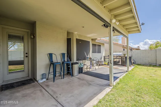 a swimming pool with an outdoor seating
