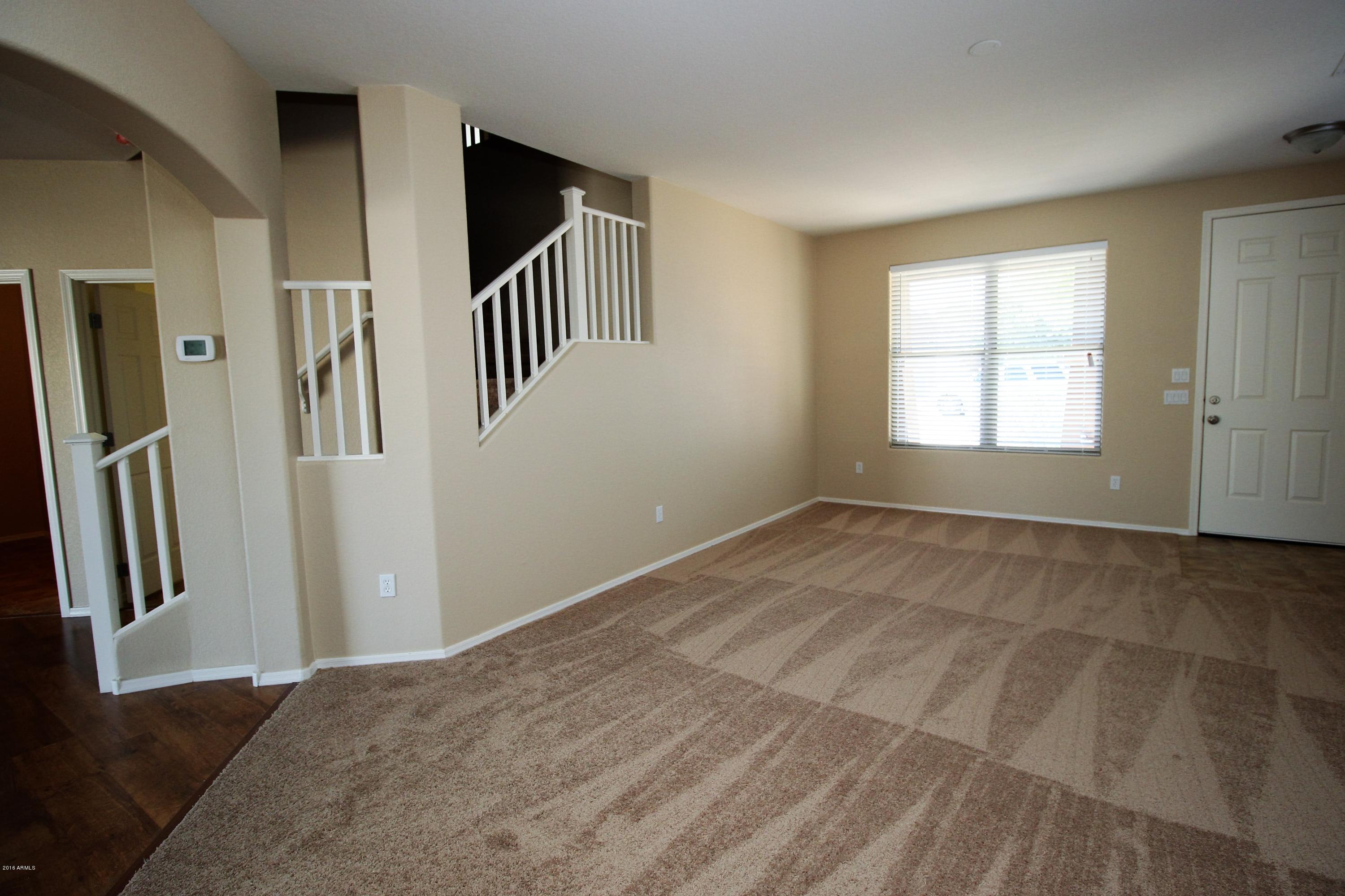45774 West Ranch Road Maricopa, AZ 85139 - Photo 6 of 25 a view of an empty room with a window
