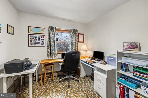 a workspace with furniture and a window