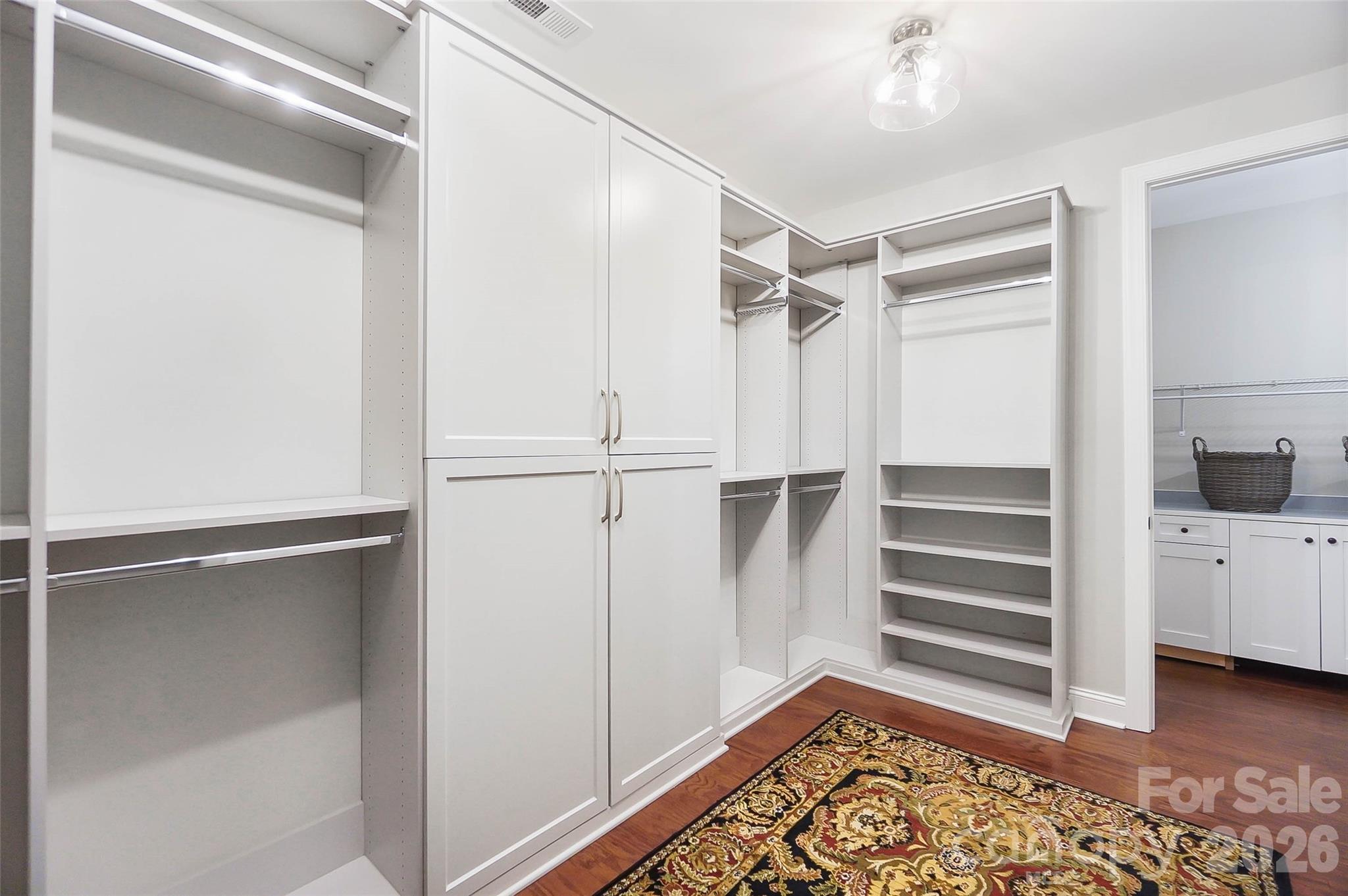 8614 Preserve Pond Road Cornelius, NC 28031 - Photo 31 of 48 a view of walk in closet with empty racks