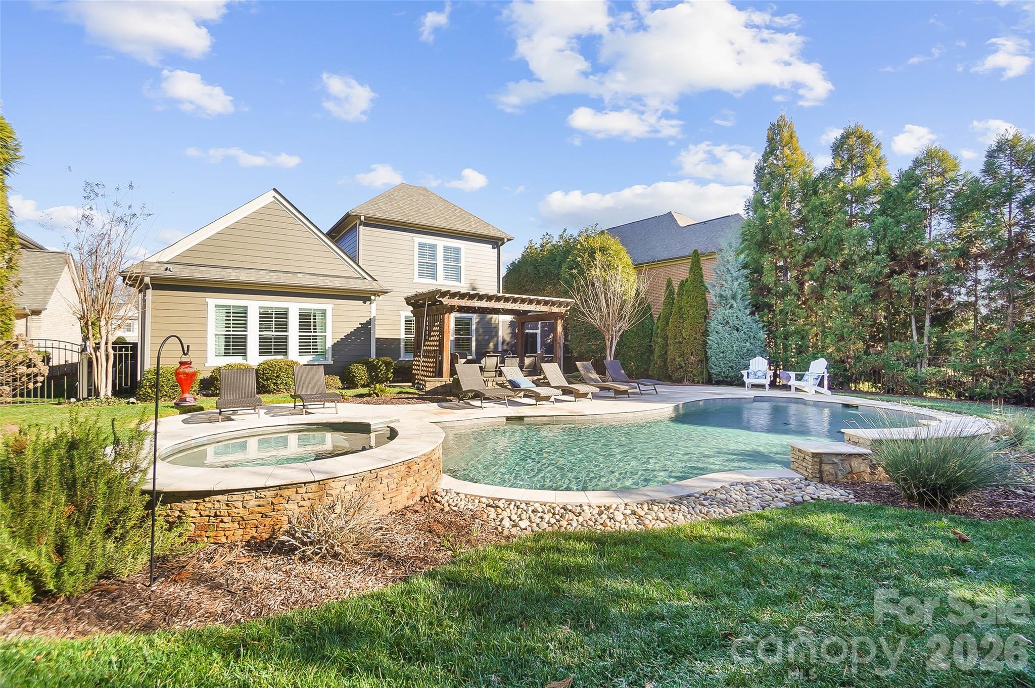 8614 Preserve Pond Road Cornelius, NC 28031 - Photo 46 of 48 a front view of a house with garden and patio