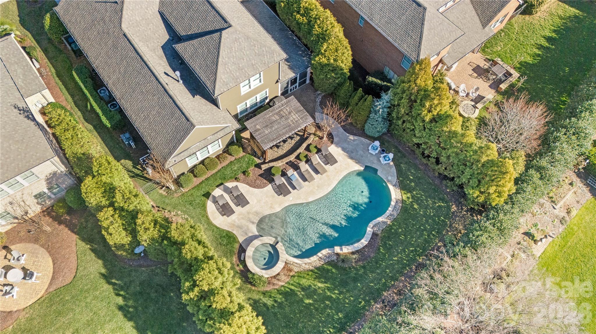 8614 Preserve Pond Road Cornelius, NC 28031 - Photo 8 of 48 an aerial view of a house with garden space and swimming pool