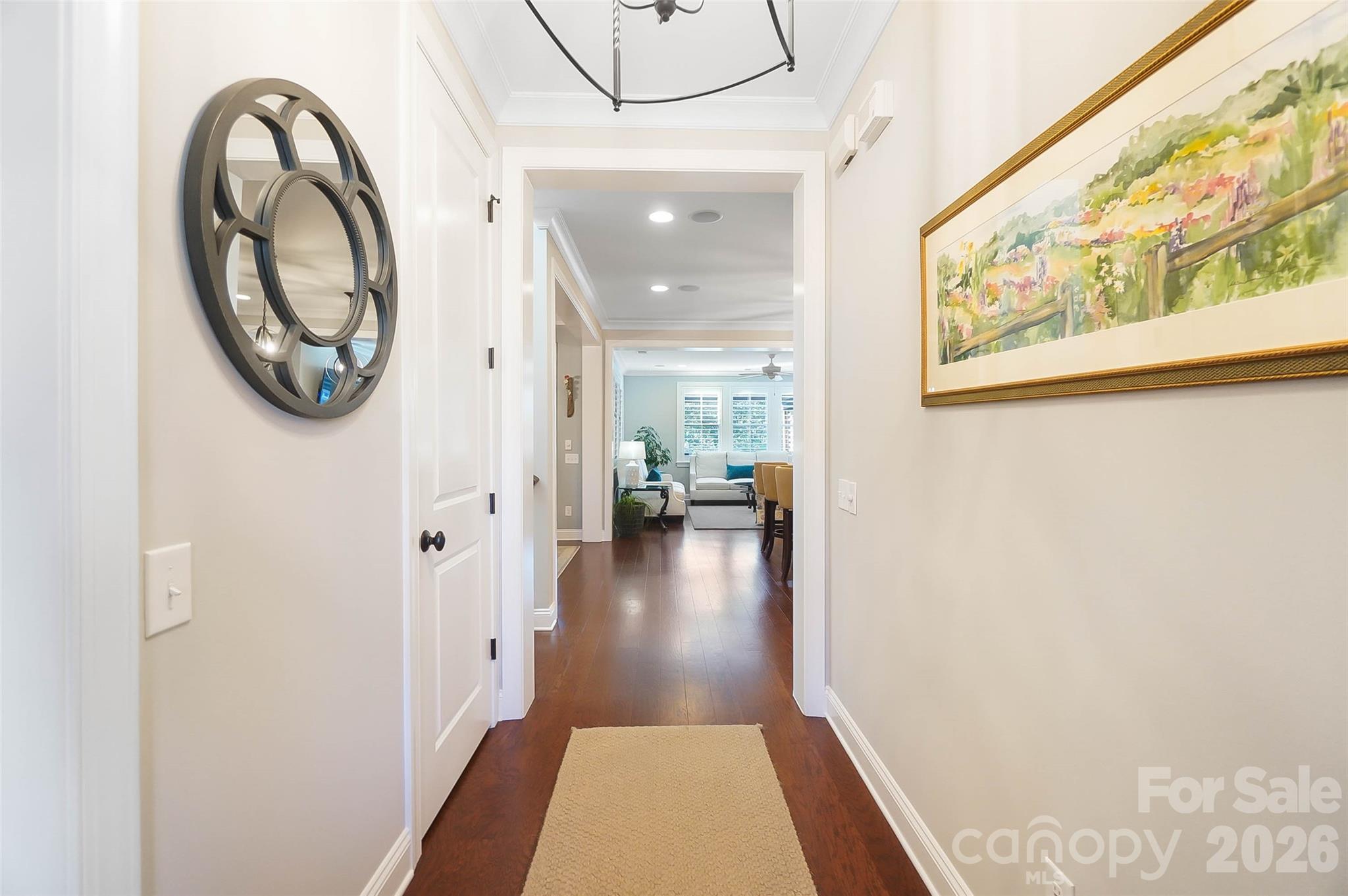 8614 Preserve Pond Road Cornelius, NC 28031 - Photo 9 of 48 a view of a hallway with wooden floor and a bathroom