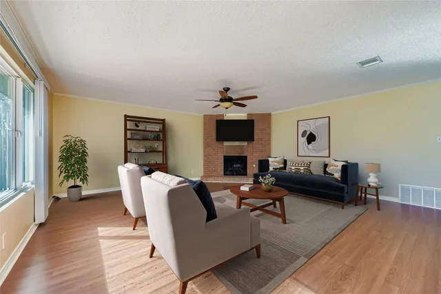a living room with furniture or couch and a wooden floor
