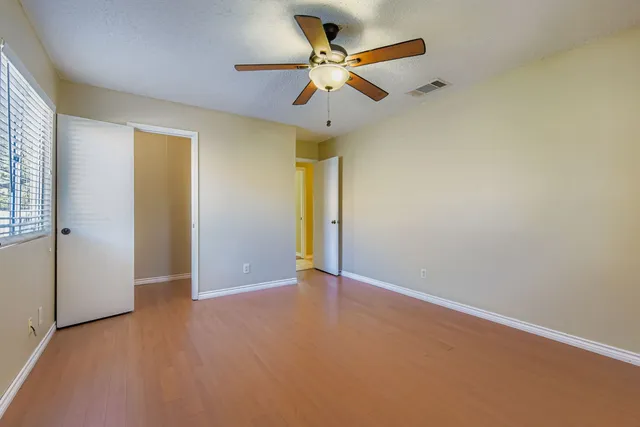 a bathroom with a shower a toilet and a sink