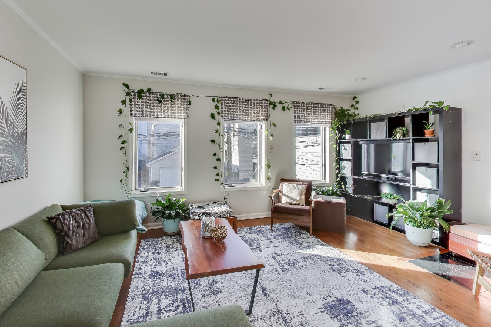 3442 North Damen Avenue, Unit 3 Chicago, IL 60618 - Photo 3 of 34 a living room with furniture or couch and a potted plant