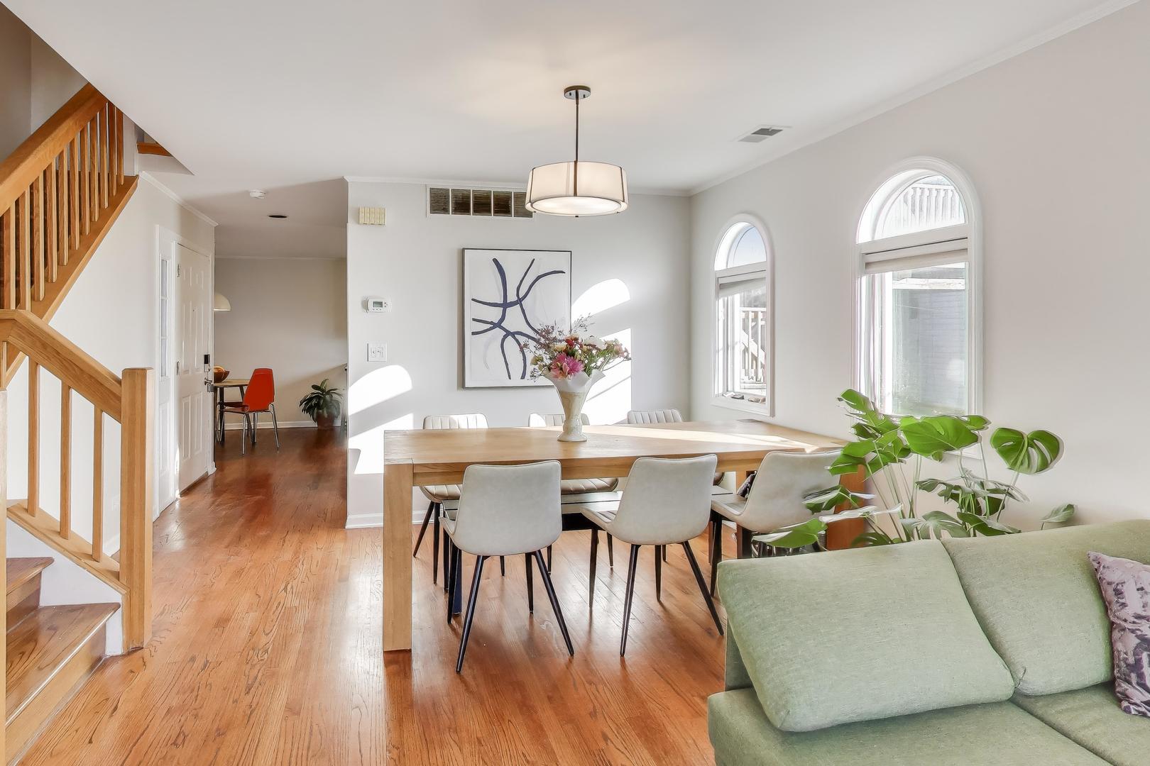 3442 North Damen Avenue, Unit 3 Chicago, IL 60618 - Photo 5 of 34 a view of a dining room with furniture and wooden floor