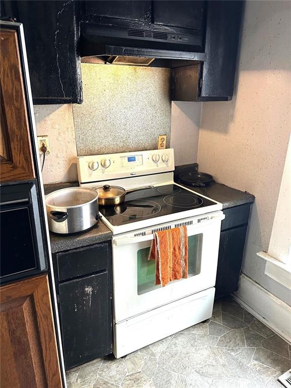 111 Griffin Street Northwest Atlanta, GA 30314 - Photo 5 of 9 a stove top oven sitting inside of a kitchen