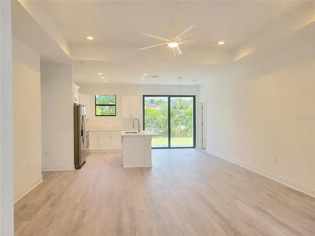 a view of kitchen with furniture and wooden floor